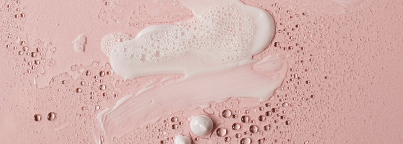 image of white foam texture on pink background