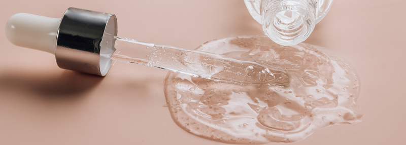 image of pipette in pool of skincare gel